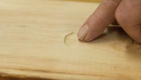 https://housecallsdiy.com/uploads/projects/Man-pointing-to-dent-in-unfinished-wood_Web.jpg