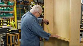 https://housecallsdiy.com/uploads/projects/Man_measuring_inside_of_cabinet_with_measuring_tape_WEB.jpg