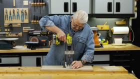 https://housecallsdiy.com/uploads/projects/Man_uses_a_portable_drill_press_to_drill_a_straight_hole_WEB.jpg