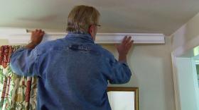 https://housecallsdiy.com/uploads/projects/Placing-Molding-on-Wall.jpg