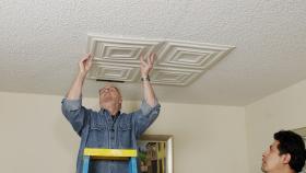 https://housecallsdiy.com/uploads/projects/Ron_Pressing_Foam_Tile_on_Ceiling2.jpg