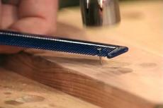 holding and hammering small nails