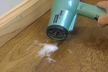 using a hair dryer to melt wax