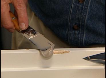 Using polyester resin to fill hole in wood