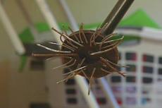 using a magnet to pick up nails