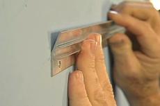 installing the Hangman aluminum strip
