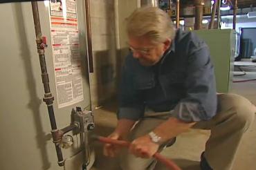 attaching a garden hose to the drain valve