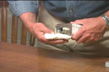 using paint thinner to clean the table