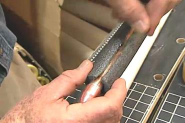 applying insulation to water pipe