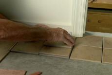 fitting tiles around a door casing