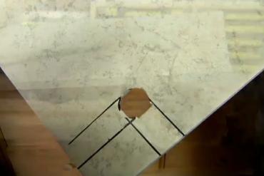 a cut hole in a ceramic tile